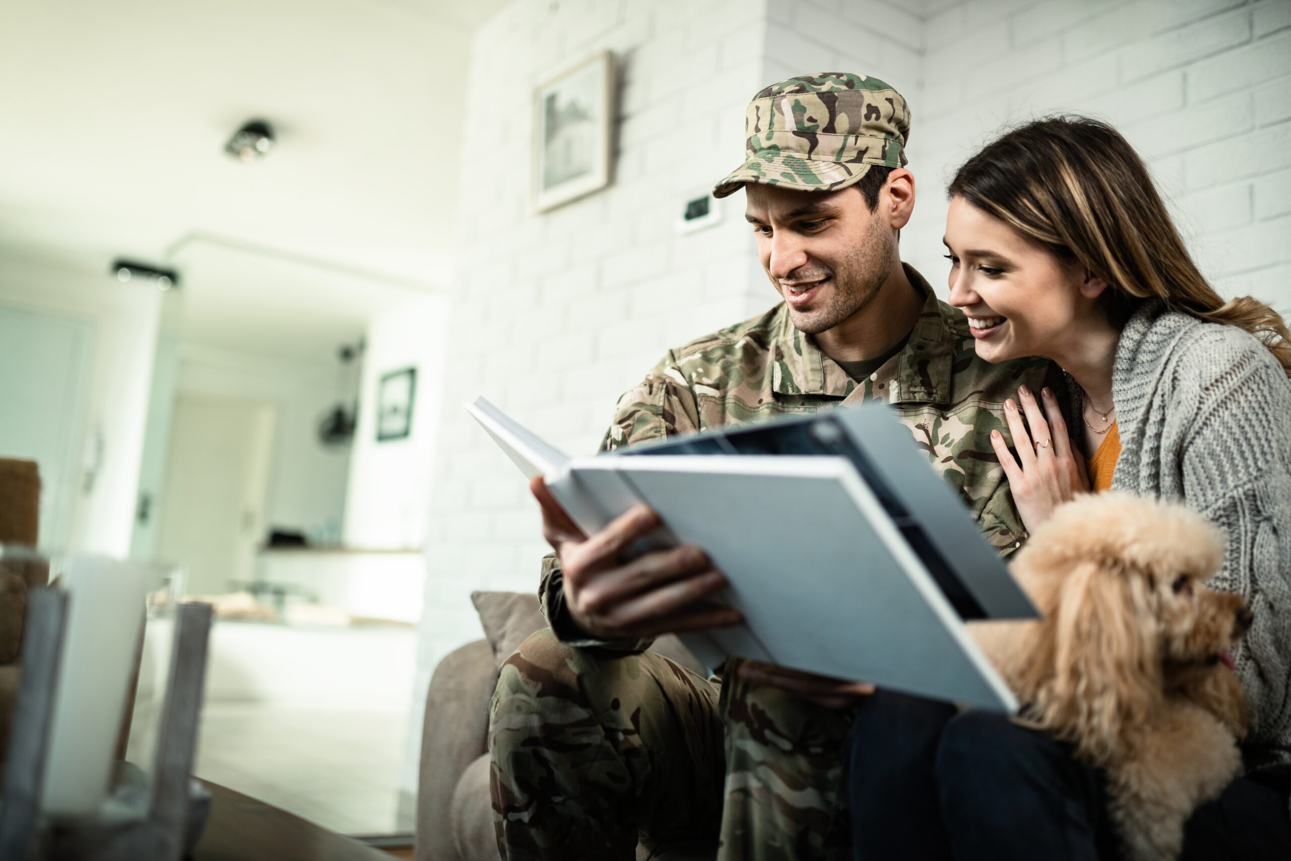 military veteran and his wife in their home